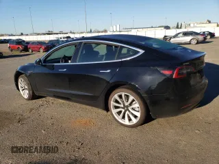 2019 Tesla Model 3 Mid Range with VIN 5YJ3E1EA6KF436152, listed as a Copart auction lot 50399265 with 62,676 mi miles and Salvage Title. Bid and sale history available at DreamBid. Image 2.