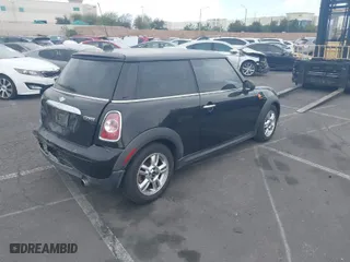 2013 MINI Cooper Hardtop with VIN WMWSU3C50DT682238, listed as a IAAI auction lot 41919592 with 148,035 mi miles. Bid and sale history available at carsss.com. Image 4.