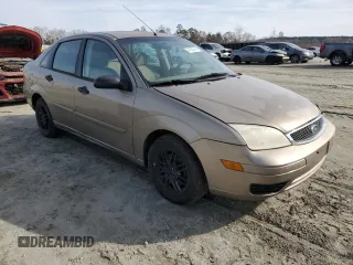 2005 Ford Focus S with VIN 1FAFP34N35W141023, listed as a Copart auction lot 84230574 with 244,545 mi miles and Salvage Title. Bid and sale history available at carsss.com. Image 4.