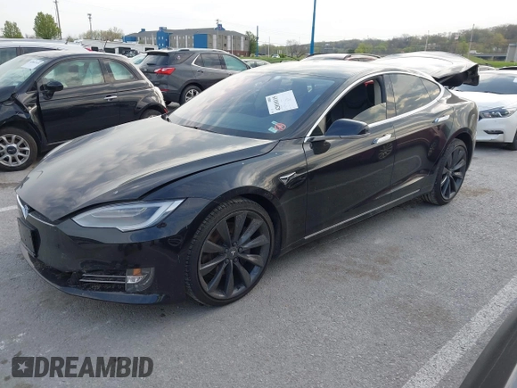 2017 Tesla Model S 100D with VIN 5YJSA1E28HF188981, listed as a IAAI auction lot 42010115 with 76,327 mi miles and . Bid and sale history available at DreamBid. Image 2.