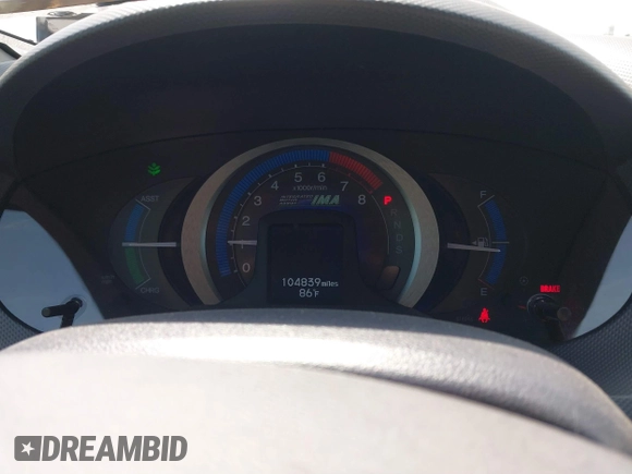 2010 Honda Insight EX with VIN JHMZE2H73AS009253, listed as a IAAI auction lot 41882569 with 104,839 mi miles and . Bid and sale history available at DreamBid. Image 7.