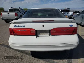 1996 Ford Thunderbird LX z VIN 1FALP62W7TH119284, wystawiony jako Copart lot #71701084 z przebiegiem 239 462 mil mil oraz Szkoda całkowita • Salvage title. Historia ofert i sprzedaży dostępna na DreamBid. Obrazek 6.