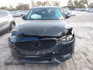 2019 Mazda CX-5 Sport with VIN JM3KFABMXK0693540, listed as a IAAI auction lot 41523569 with 57,895 mi miles and . Bid and sale history available at DreamBid. Image 12.