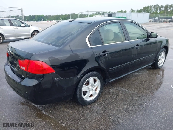 2010 Kia Optima LX with VIN KNAGG4A85A5375227, listed as a IAAI auction lot 42019118 with 221,324 mi miles. Bid and sale history available at carsss.com. Image 4.