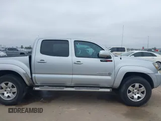 2009 Toyota Tacoma PreRunner with VIN 3TMJU62NX9M081748, listed as a IAAI auction lot 41608525 with 210,999 mi miles. Bid and sale history available at carsss.com. Image 13.