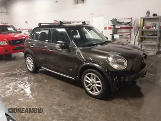 2015 MINI Cooper Countryman S with VIN WMWZC5C57FWP44538, listed as a IAAI auction lot 41089061 with 138,827 mi miles. Bid and sale history available at carsss.com. Image 1.