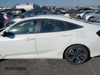 2017 Honda Civic EX-T with VIN 19XFC1E38HE002205, listed as a IAAI auction lot 40891678 with 10,398 mi miles and . Bid and sale history available at DreamBid. Image 14.