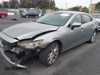 2014 Mazda 6 i Touring with VIN JM1GJ1V60E1141831, listed as a IAAI auction lot 42131200 with 86,597 mi miles and . Bid and sale history available at DreamBid. Image 2.
