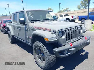 2021 Jeep Gladiator Rubicon with VIN 1C6JJTBG8ML561572, listed as a IAAI auction lot 42626314 with 16,318 mi miles and . Bid and sale history available at DreamBid. Image 1.