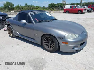 2003 Mazda MX-5 Miata Cloth with VIN JM1NB353930311340, listed as a IAAI auction lot 42145967 with 194,740 mi miles and . Bid and sale history available at DreamBid. Image 1.