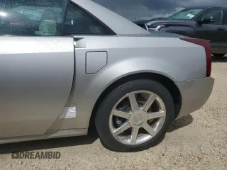 2006 Cadillac XLR z VIN 1G6YV36A365601441, wystawiony jako Copart lot #73945994 z przebiegiem Nie podano mil oraz Szkody całkowita. Historia ofert i sprzedaży dostępna na DreamBid. Obrazek 12.