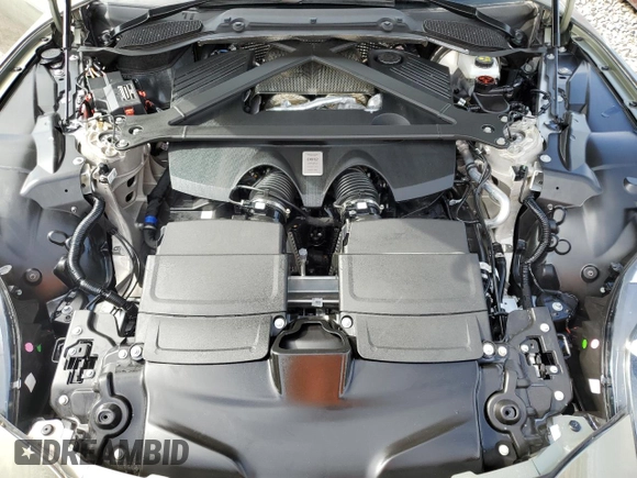 2025 Aston Martin DB12 z VIN SCFRMFFW4SGL15065, wystawiony jako Copart lot #74953394 z przebiegiem Nie podano mil oraz Nie do naprawy. Historia ofert i sprzedaży dostępna na DreamBid. Obrazek 11.