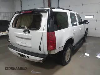 2007 GMC Yukon SLT with VIN 1GKFK130X7R203221, listed as a IAAI auction lot 41583409 with 254,586 mi miles. Bid and sale history available at carsss.com. Image 4.
