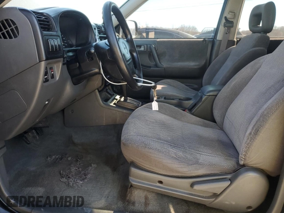 1999 Isuzu Rodeo S with VIN 4S2CK58W2X4336401, listed as a Copart auction lot 83872484 with 191,278 mi miles and Salvage title. Bid and sale history available at DreamBid. Image 7.