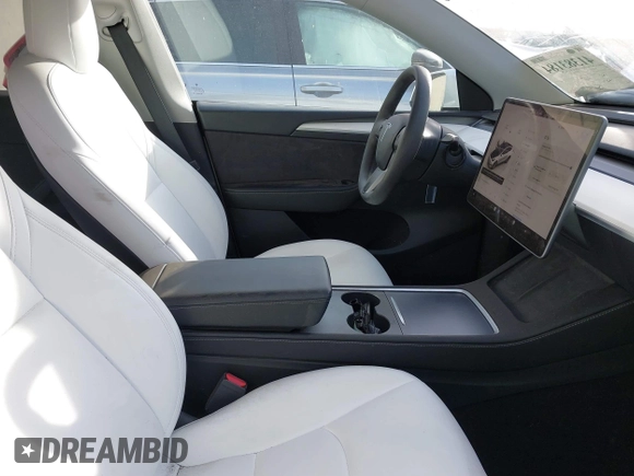 2023 Tesla Model Y Long Range z VIN 7SAYGDEE9PF623285, wystawiony jako IAAI lot #41383184 z przebiegiem 34 092 mil mil oraz . Historia ofert i sprzedaży dostępna na DreamBid. Obrazek 5.