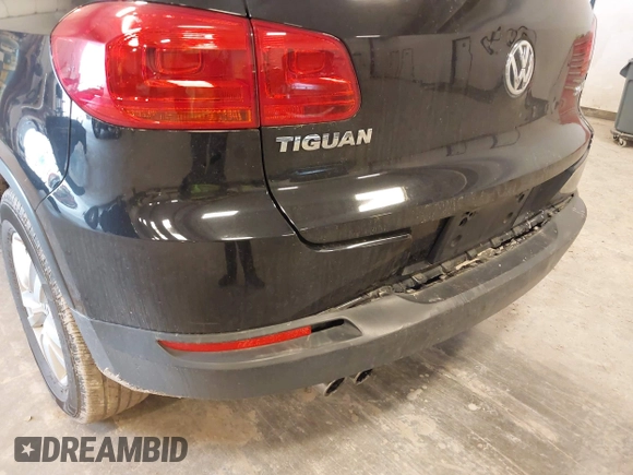 2014 Volkswagen Tiguan SE z VIN WVGAV3AX9EW614094, wystawiony jako IAAI lot #42350601 z przebiegiem 128 996 mil mil oraz . Historia ofert i sprzedaży dostępna na DreamBid. Obrazek 12.