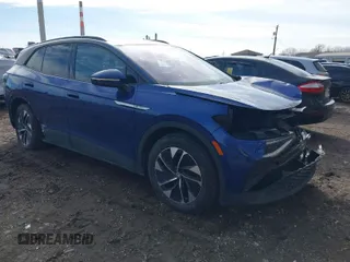 2022 Volkswagen ID.4 Pro S z VIN WVGGNPE25NP042502, wystawiony jako IAAI lot #41545797 z przebiegiem 26 128 mil mil oraz . Historia ofert i sprzedaży dostępna na DreamBid. Obrazek 1.