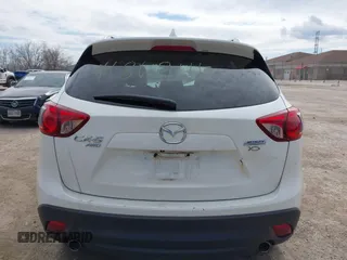 2014 Mazda CX-5 Grand Touring with VIN JM3KE4DY8E0397330, listed as a IAAI auction lot 41868116 with 180,891 mi miles. Bid and sale history available at carsss.com. Image 16.