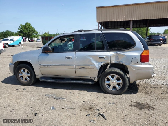 2004 GMC Envoy SLT with VIN 1GKDS13S942193519, listed as a Copart auction lot 84952984 with 156,599 mi miles and Salvage Title. Bid and sale history available at carsss.com. Image 2.