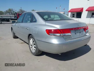 2006 Hyundai Azera SE with VIN KMHFC46FX6A107141, listed as a IAAI auction lot 41793111 with 124,137 mi miles and . Bid and sale history available at DreamBid. Image 3.