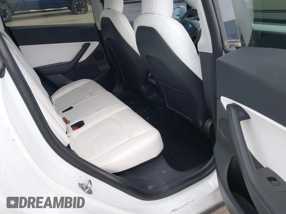 2021 Tesla Model Y Standard Range with VIN 5YJYGDED9MF121828, listed as a IAAI auction lot 42119518 with 34,454 mi miles and . Bid and sale history available at carsss.com. Image 8.
