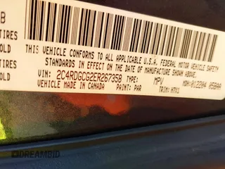 2014 Dodge Grand Caravan SXT with VIN 2C4RDGCG2ER267358, listed as a IAAI auction lot 41001692 with 186,763 mi miles and . Bid and sale history available at DreamBid. Image 9.