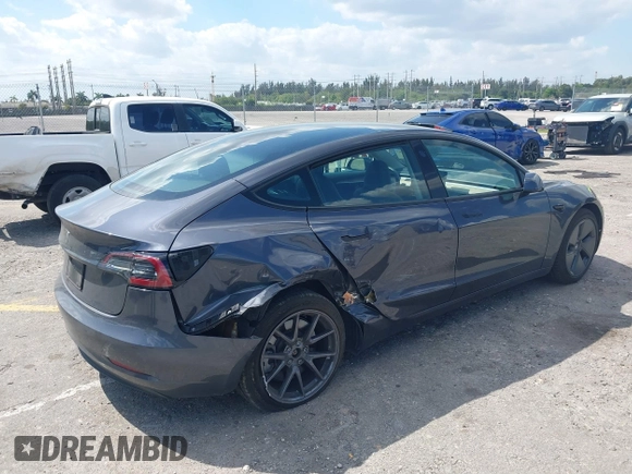 2023 Tesla Model 3 with VIN 5YJ3E1EA3PF623114, listed as a IAAI auction lot 41710385 with 31,663 mi miles and . Bid and sale history available at carsss.com. Image 4.