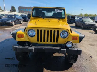 2004 Jeep Wrangler Sport z VIN 1J4FA49S64P751615, wystawiony jako Copart lot #55810895 z przebiegiem 128 165 mil mil oraz Szkoda całkowita • Salvage title. Historia ofert i sprzedaży dostępna na DreamBid. Obrazek 5.