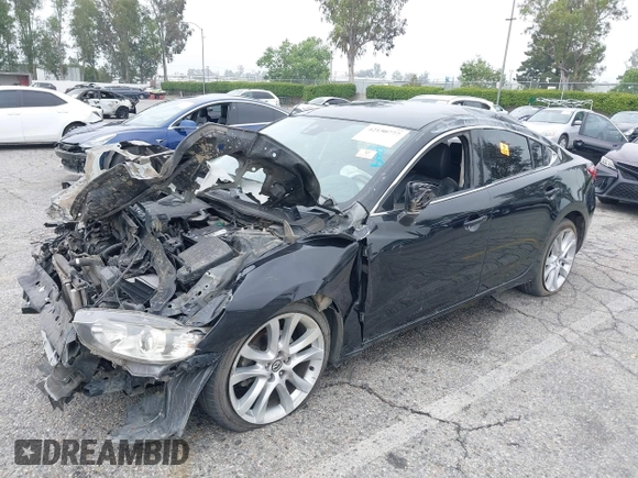 2014 Mazda 6 i Touring with VIN JM1GJ1T6XE1162480, listed as a IAAI auction lot 42150777 with 148,113 mi miles and . Bid and sale history available at DreamBid. Image 2.