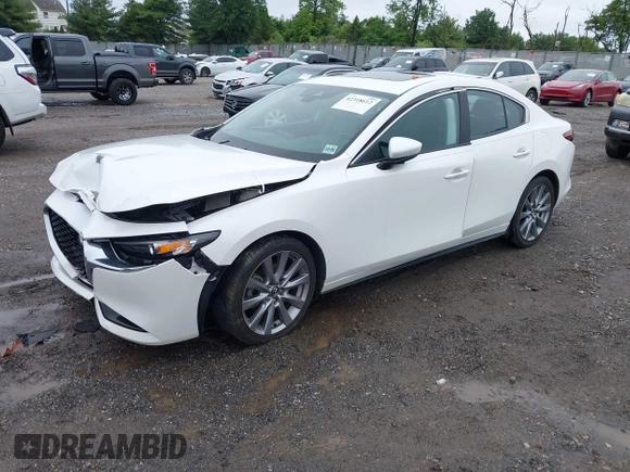 2021 Mazda 3 Preferred z VIN 3MZBPBCL0MM250862, wystawiony jako IAAI lot #42318612 z przebiegiem 86 056 mil mil oraz . Historia ofert i sprzedaży dostępna na DreamBid. Obrazek 20.