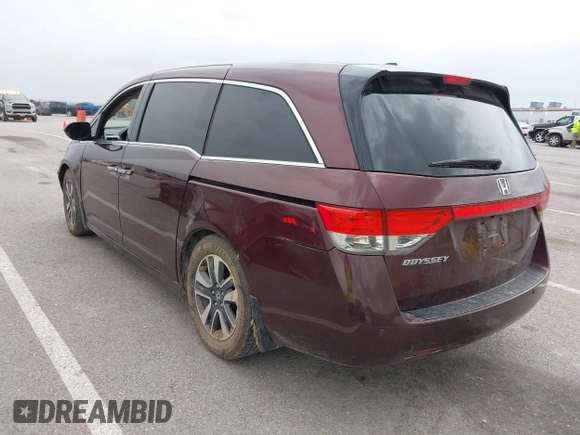 2014 Honda Odyssey Touring with VIN 5FNRL5H94EB127695, listed as a IAAI auction lot 41936109 with 221,786 mi miles and . Bid and sale history available at DreamBid. Image 3.