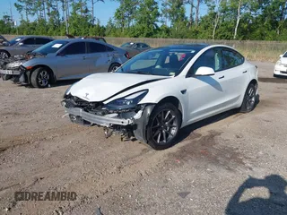 2023 Tesla Model 3 with VIN 5YJ3E1EA9PF557880, listed as a IAAI auction lot 42481413 with 40,582 mi miles and . Bid and sale history available at DreamBid. Image 18.
