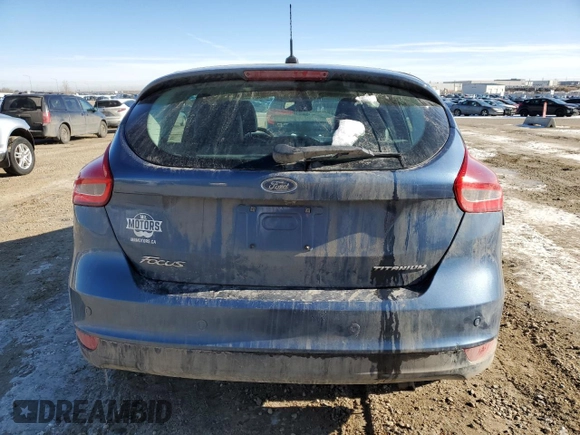 2018 Ford Focus Titanium z VIN 1FADP3N2XJL297048, wystawiony jako Copart lot #61579925 z przebiegiem 68 774 mil mil oraz Szkoda całkowita • Salvage title. Historia ofert i sprzedaży dostępna na DreamBid. Obrazek 6.