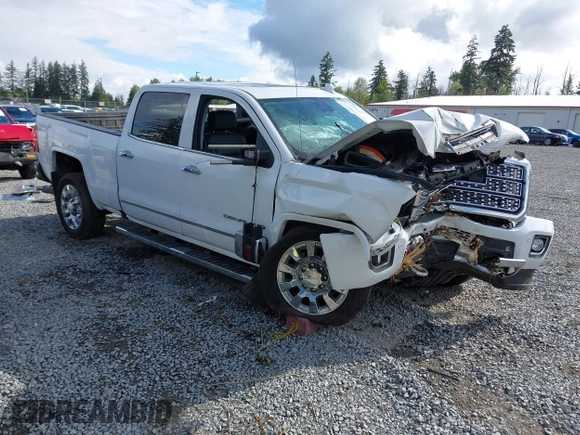 2019 GMC Sierra 2500HD Denali z VIN 1GT12SEY3KF269442, wystawiony jako IAAI lot #42231991 z przebiegiem 75 172 mil mil oraz . Historia ofert i sprzedaży dostępna na DreamBid. Obrazek 1.