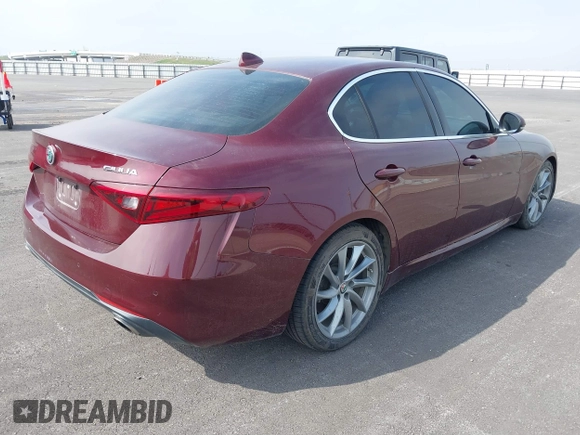 2018 Alfa Romeo Giulia with VIN ZARFAEBN8J7566581, listed as a IAAI auction lot 41524224 with 56,863 mi miles. Bid and sale history available at carsss.com. Image 4.