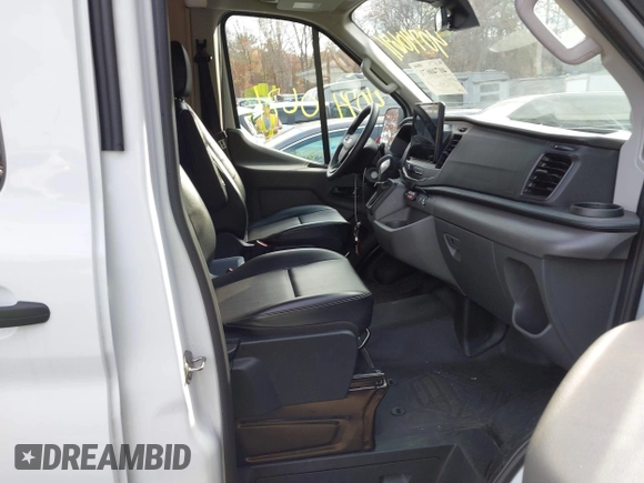 2023 Ford Transit Cargo with VIN 1FTBR1C86PKA52494, listed as a IAAI auction lot 40740671 with 9,999 mi miles and . Bid and sale history available at DreamBid. Image 5.