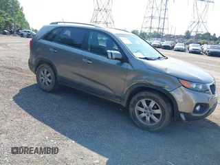 2011 Kia Sorento LX with VIN 5XYKTCA14BG141840, listed as a IAAI auction lot 42423860 with 210,154 mi miles and . Bid and sale history available at DreamBid. Image 1.