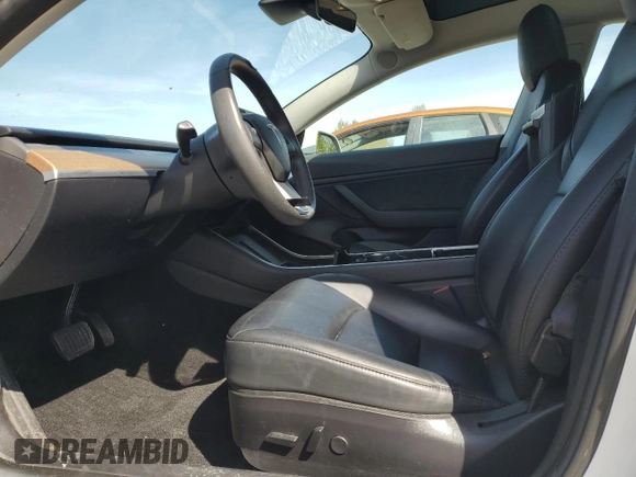 2019 Tesla Model 3 Mid Range with VIN 5YJ3E1EA0KF484178, listed as a Copart auction lot 53121915 with 64,929 mi miles and Salvage Title. Bid and sale history available at DreamBid. Image 7.