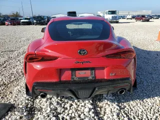 2021 Toyota GR Supra 2.0 with VIN WZ1DB2C0XMW043722, listed as a Copart auction lot 82909334 with 0 mi miles and Salvage Title. Bid and sale history available at carsss.com. Image 6.