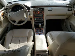1999 Mercedes-Benz E-Class with VIN WDBJH65F3XA749696, listed as a Copart auction lot 77656084 with 163,802 mi miles and Salvage Title. Bid and sale history available at carsss.com. Image 8.