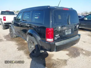 2007 Dodge Nitro SLT with VIN 1D8GT58K97W666680, listed as a IAAI auction lot 41573904 with 171,795 mi miles. Bid and sale history available at carsss.com. Image 3.