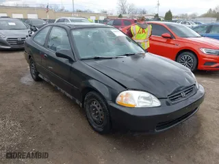 1997 Honda Civic EX with VIN 1HGEJ8242VL044722, listed as a IAAI auction lot 42045941 with 266,481 mi miles. Bid and sale history available at carsss.com. Image 1.