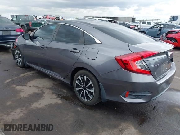 2017 Honda Civic LX with VIN 19XFC2F50HE055888, listed as a IAAI auction lot 42202494 with 147,354 mi miles and . Bid and sale history available at DreamBid. Image 3.