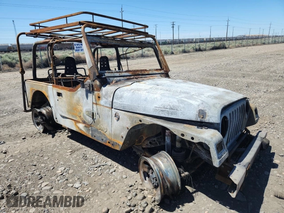 2000 Jeep Wrangler SE with VIN 1J4FA29P2YP797531, listed as a Copart auction lot 56058845 with Not provided miles and Salvage title. Bid and sale history available at DreamBid. Image 4.