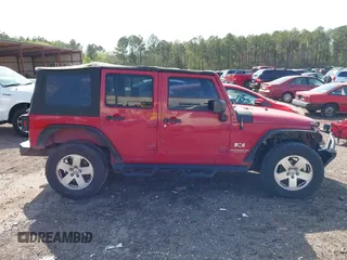 2007 Jeep Wrangler Unlimited X with VIN 1J4GB39197L150245, listed as a IAAI auction lot 41920390 with 239,532 mi miles and . Bid and sale history available at DreamBid. Image 13.