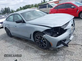 2024 BMW i4 M50 z VIN WBY33AW00RFR80145, wystawiony jako IAAI lot #42305622 z przebiegiem 18 900 mil mil oraz . Historia ofert i sprzedaży dostępna na DreamBid. Obrazek 1.
