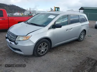 2011 Honda Odyssey EX-L with VIN 5FNRL5H60BB012206, listed as a IAAI auction lot 41982987 with 220,913 mi miles and . Bid and sale history available at carsss.com. Image 17.