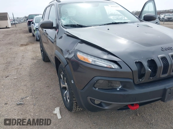 2016 Jeep Cherokee Trailhawk z VIN 1C4PJMBS4GW167650, wystawiony jako IAAI lot #41936549 z przebiegiem 218 000 mil mil oraz . Historia ofert i sprzedaży dostępna na DreamBid. Obrazek 6.