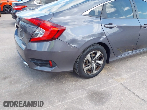 2020 Honda Civic LX with VIN 2HGFC2F65LH575320, listed as a IAAI auction lot 42009564 with Not Provided miles and . Bid and sale history available at DreamBid. Image 4.