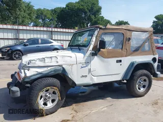 1998 Jeep Wrangler Sport z VIN 1J4FY19S3WP776209, wystawiony jako IAAI lot #42493513 z przebiegiem 113 130 mil mil oraz . Historia ofert i sprzedaży dostępna na DreamBid. Obrazek 6.